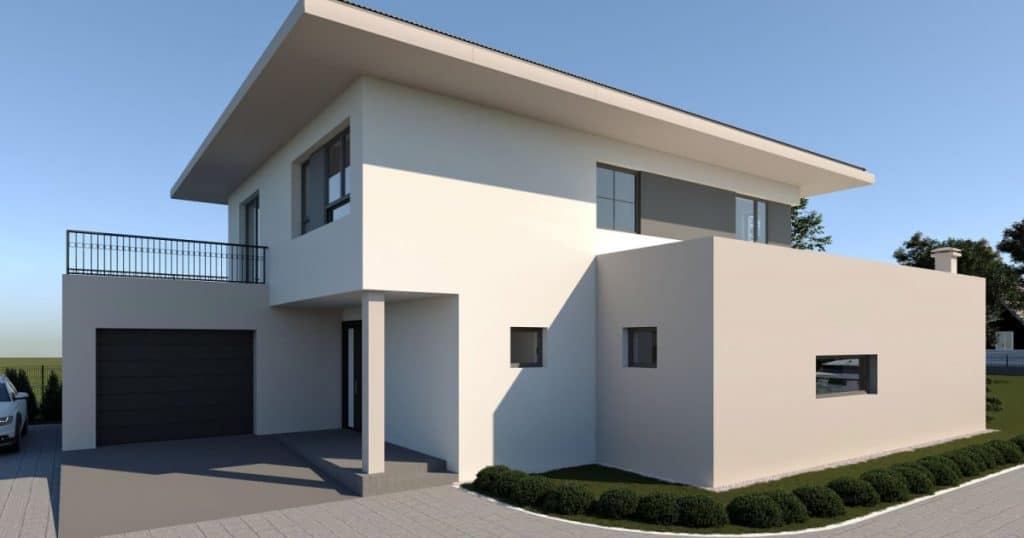 Maison dont la façade est blanche et rose pâle.