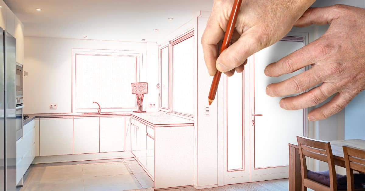 Een hand houdt een rood potlood vast en tekent een stopcontact op een plan van een keuken en eethoek. Links zijn de frigo en ovens in werkelijke vorm zichtbaar.