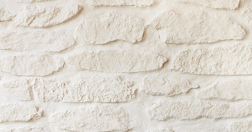 Witte crepi met baksteenmotief